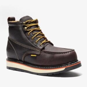 A brown work boot with yellow laces and a white sole.