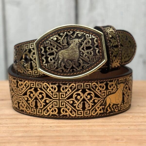 A belt with an animal on it and some brown designs