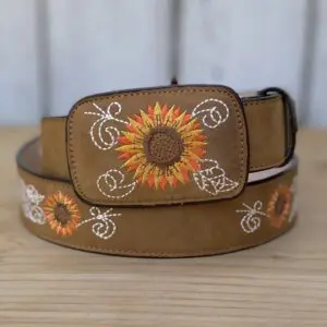 A brown belt with an embroidered sunflower on it.