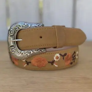 A close up of a belt with flowers on it