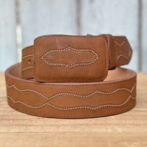 A brown belt with white stitching on it