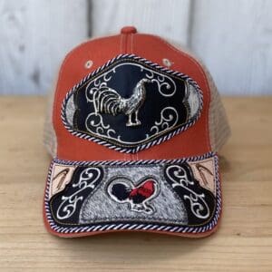 A red hat with an embroidered rooster on it.